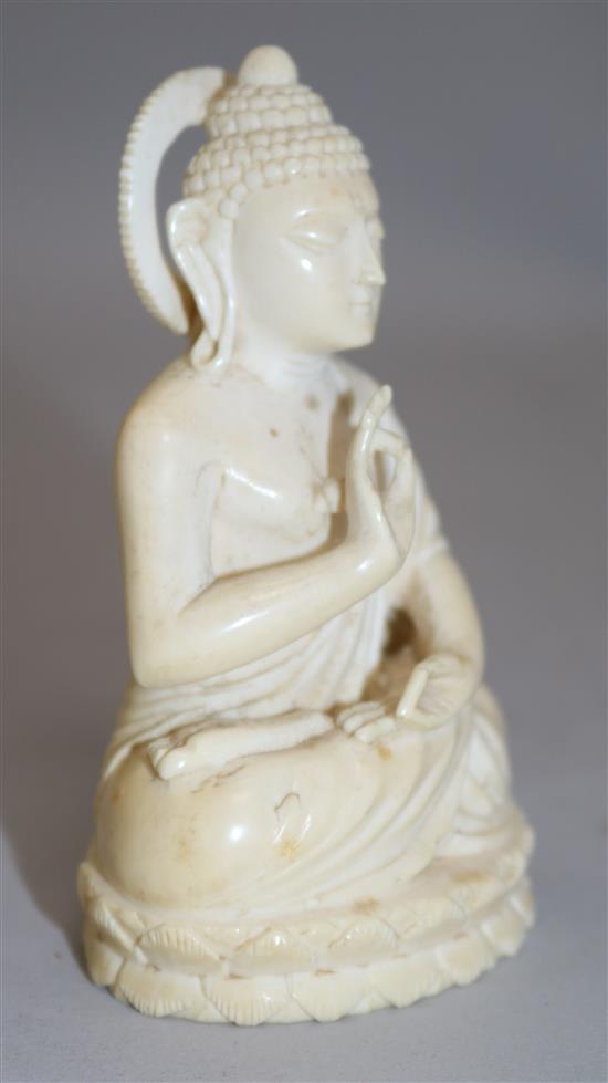 A Chinese ivory seated figure of Buddha Shakyamuni, early 20th century, 11cm